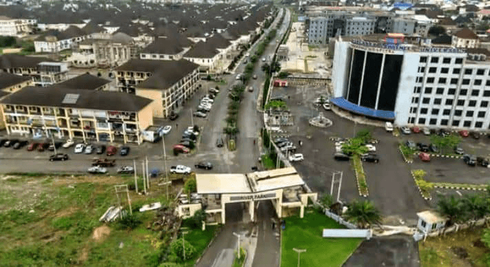 Aerial view of River Park Estate entrance and gate looking down the main road